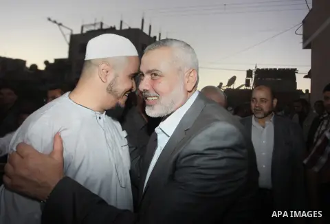 Senior leader of Hamas Ismail Haniyeh gets welcome during his inspection visit to the Deir al-Balah in the central Gaza Strip, on September 10, 2014. Hamas's exiled deputy leader said Wednesday that indirect talks with I...