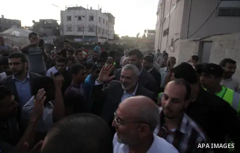 Senior leader of Hamas Ismail Haniyeh gets welcome during his inspection visit to the Deir al-Balah in the central Gaza Strip, on September 10, 2014. Hamas's exiled deputy leader said Wednesday that indirect talks with I...