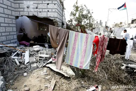 A Palestinian man walks past a destroyed house in Khan Yunis in the southern Gaza Strip on September 11, 2014. Israel's deputy foreign minister,Tzahi Hanegbi , warned that Hamas was likely to resume "violence" if it feel...