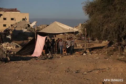 Palestinian students walk past houses that witnesses said were destroyed by the Israeli offensive, as they make their way to school on the first day of the new school year in the east of Gaza City September 14, 2014. An...
