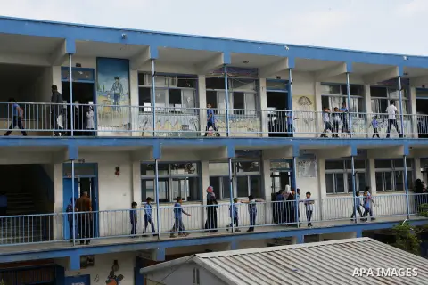 Palestinian students stand inside their a United Nations-run school, on the first day of the new school year in Rafah refugee camp in the southern Gaza Strip September 14, 2014. An open-ended ceasefire between Israel and...