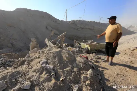 Palestinian workers smash large stones into small gravels to be used for building houses that witnesses said were destroyed by Israel during its offensive, in Gaza City September 14, 2014. An open-ended ceasefire between...
