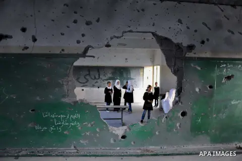 Palestinian students study inside their classroom on the second day of the school year in al-Sheiaeiya neighborhood in the east of Gaza City, on Sept 15, 2014. School year started in the Gaza Strip on Sunday after a thre...