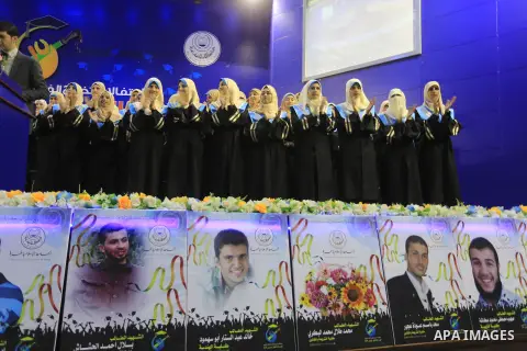 Palestinian students participate in their graduation ceremony at the Islamic University in Gaza city on September 16, 2014, supposed to be involved some of students were killed during air raids on the Gaza Strip. Photo b...