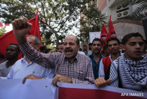 Palestinian University students take part in a protest to demand for exemption from tuition fees, in Gaza city, on Sept. 17, 2014. An open-ended ceasefire between Israel and Hamas-led Gaza militants, mediated by Egypt, t...