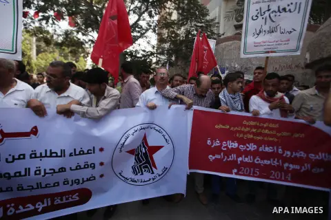 Palestinian University students take part in a protest to demand for exemption from tuition fees, in Gaza city, on Sept. 17, 2014. An open-ended ceasefire between Israel and Hamas-led Gaza militants, mediated by Egypt, t...