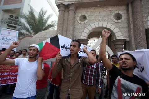 Palestinian University students take part in a protest to demand for exemption from tuition fees, in Gaza city, on Sept. 17, 2014. An open-ended ceasefire between Israel and Hamas-led Gaza militants, mediated by Egypt, t...