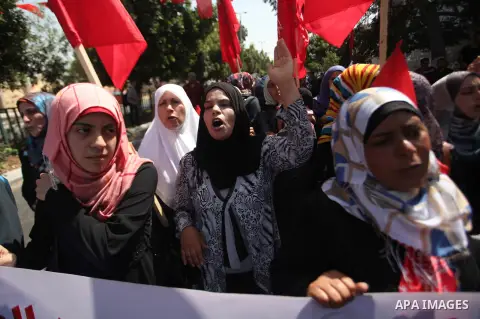 Palestinian University students take part in a protest to demand for exemption from tuition fees, in Gaza city, on Sept. 17, 2014. An open-ended ceasefire between Israel and Hamas-led Gaza militants, mediated by Egypt, t...