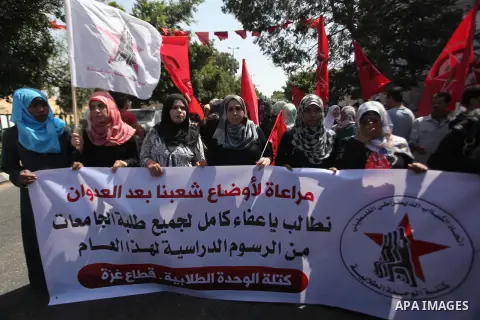 Palestinian University students take part in a protest to demand for exemption from tuition fees, in Gaza city, on Sept. 17, 2014. An open-ended ceasefire between Israel and Hamas-led Gaza militants, mediated by Egypt, t...