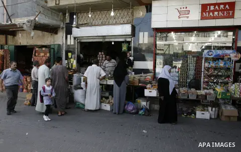 Palestinians shop at a street market in Rafah in the southern Gaza Strip on Sept. 17, 2014. An open-ended ceasefire between Israel and Hamas-led Gaza militants, mediated by Egypt, took effect on August 26 after a seven-w...