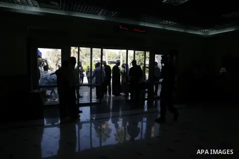 Palestinians Muslim pilgrims wait at the Rafah crossing between Egypt and the southern Gaza Strip, on Sept. 18, 2014, before leaving for the annual hajj pilgrimage to the holy city of Mecca. Hundreds of Palestinian pilgr...