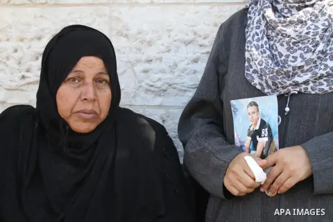 Palestinians hold pictures of their missing relatives during a protest, in Gaza city on Sept. 21, 2014. Gazans are missing after one of the deadliest migrant shipwrecks on record, a boat, with 500 people on board, was in...