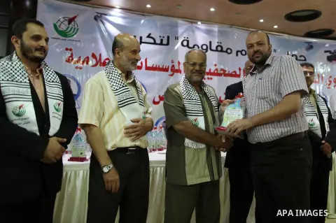 Palestinians attend a ceremony to honor the relatives of the media members who were killed in the Israeli offensive on Sep. 22, 2014. An open-ended ceasefire between Israel and Hamas-led Gaza militants, mediated by Egypt...