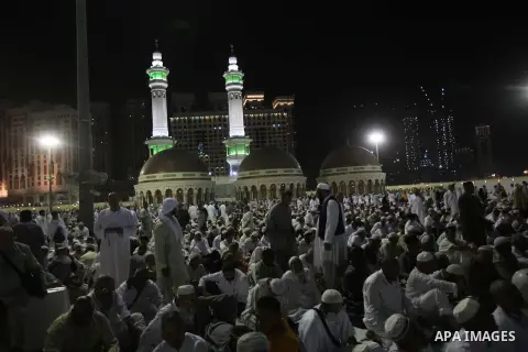 Muslim pilgrims walk outside the Grand Mosque during the annual Hajj in Mecca, Saudi Arabia, Sept. 23, 2014. About 160 countries converge annually on the Islamic cities of Mecca and Medina in western Saudi Arabia for the...