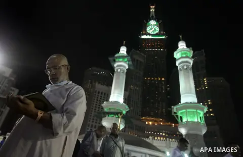 Muslim pilgrims walk outside the Grand Mosque during the annual Hajj in Mecca, Saudi Arabia, Sept. 23, 2014. About 160 countries converge annually on the Islamic cities of Mecca and Medina in western Saudi Arabia for the...