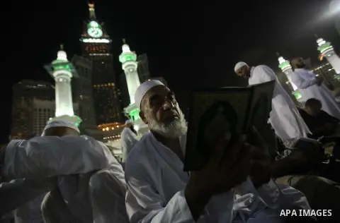 Muslim pilgrims walk outside the Grand Mosque during the annual Hajj in Mecca, Saudi Arabia, Sept. 23, 2014. About 160 countries converge annually on the Islamic cities of Mecca and Medina in western Saudi Arabia for the...