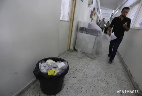 Palestinians wait at al-shifa hospital to receive treatment as clean workers protest to demand for pay their salaries, in Gaza City September 24, 2014. Photo by Mohammed Asad