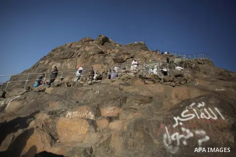 Muslim pilgrims pray at Mount Al-Noor during the annual haj pilgrimage in Mecca, on September 28, 2014, Mount Al-Noor houses Ghar-E-Hira or Hira cave, where Prophet Mohammad is said to have spent a great deal of time in...