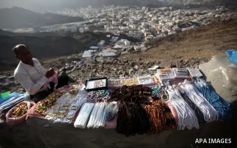 A Vendor display his goods at Mount Al-Noor during the annual haj pilgrimage in Mecca, on September 28, 2014, Mount Al-Noor houses Ghar-E-Hira or Hira cave, where Prophet Mohammad is said to have spent a great deal of ti...