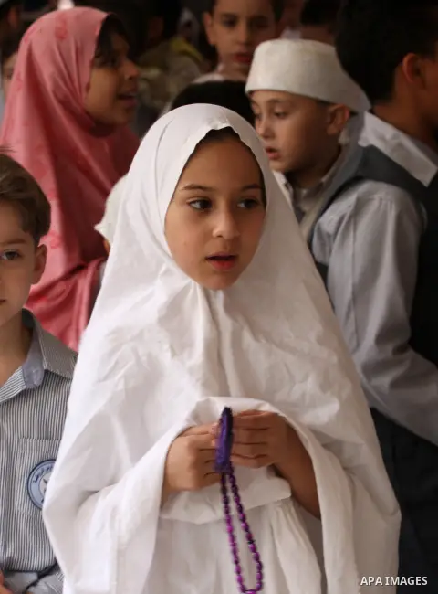 Palestinian children gather around a makeshift cube representing the holy Kaaba in the West Bank city of Nablus, on Sept. 30, 2014, as part of training children how to perform Hajj pilgrimage. Muslims from around the wor...