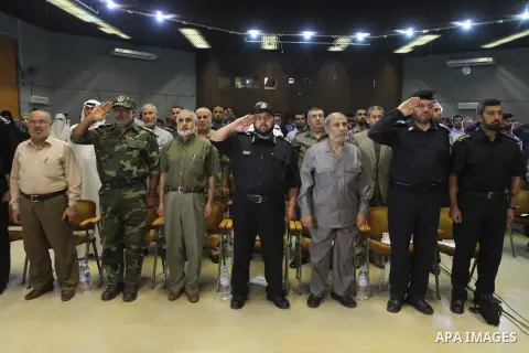 Palestinian policemen attend a ceremony to honor their relatives who were killed by Israel during the summer's fierce offensive, in Gaza city on Sep. 30, 2014. An open-ended ceasefire between Israel and Hamas-led Gaza mi...