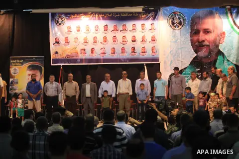 Palestinian policemen attend a ceremony to honor their relatives who were killed by Israel during the summer's fierce offensive, in Gaza city on Sep. 30, 2014. An open-ended ceasefire between Israel and Hamas-led Gaza mi...