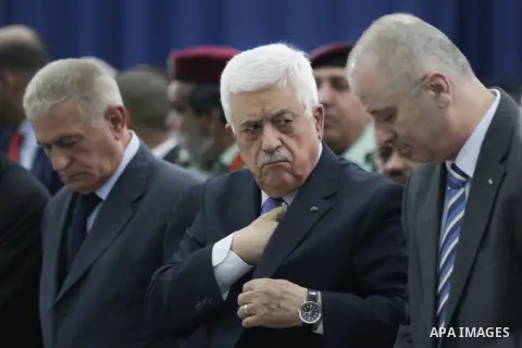Palestinian president Mahmoud Abbas attends an early morning prayer to mark Eid al-Adha or the Feast of Sacrifice, at his headquarter in the West Bank city of Ramallah on October 4, 2014. Muslims around the world are cel...