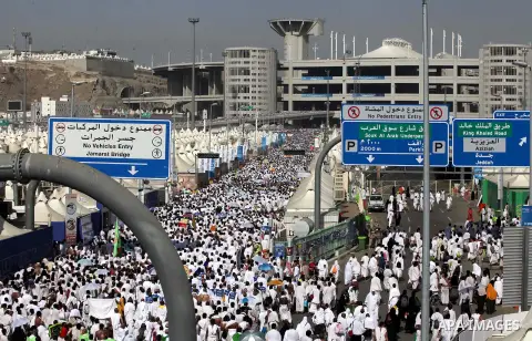 Muslim pilgrims walk to cast stones at a pillar, symbolizing the stoning of Satan, in a ritual called "Jamarat," a rite of the annual hajj, in Mina near the holy city of Mecca on October 04, 2014. The pilgrims perform a...