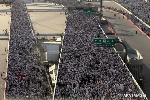 Muslim pilgrims walk to cast stones at a pillar, symbolizing the stoning of Satan, in a ritual called "Jamarat," a rite of the annual hajj, in Mina near the holy city of Mecca on October 04, 2014. The pilgrims perform a...