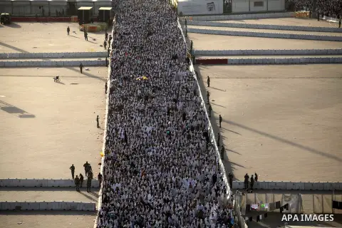 Muslim pilgrims walk to cast stones at a pillar, symbolizing the stoning of Satan, in a ritual called "Jamarat," a rite of the annual hajj, in Mina near the holy city of Mecca on October 04, 2014. The pilgrims perform a...