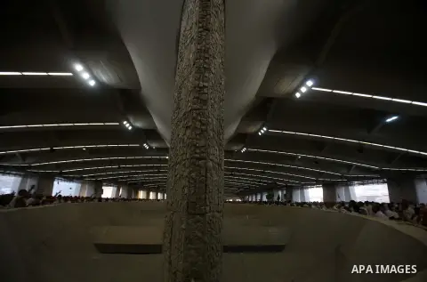 Muslim pilgrims cast stones at a pillar, symbolizing the stoning of Satan, in a ritual called "Jamarat," a rite of the annual hajj, in Mina near the holy city of Mecca on October 04, 2014. The pilgrims perform a series o...