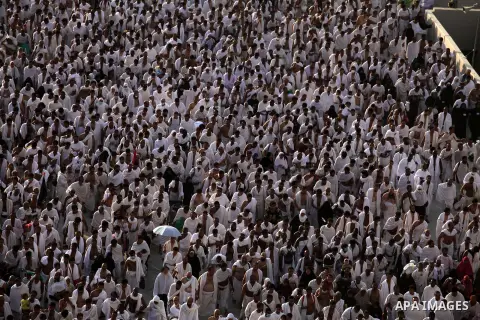 Muslim pilgrims walk to cast stones at a pillar, symbolizing the stoning of Satan, in a ritual called "Jamarat," a rite of the annual hajj, in Mina near the holy city of Mecca on October 04, 2014. The pilgrims perform a...