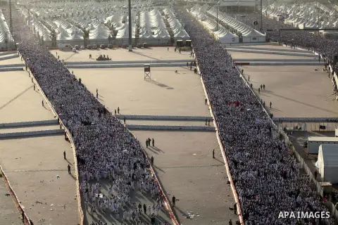 Muslim pilgrims walk to cast stones at a pillar, symbolizing the stoning of Satan, in a ritual called "Jamarat," a rite of the annual hajj, in Mina near the holy city of Mecca on October 04, 2014. The pilgrims perform a...