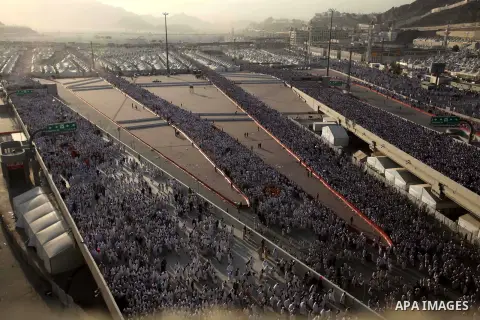 Muslim pilgrims walk to cast stones at a pillar, symbolizing the stoning of Satan, in a ritual called "Jamarat," a rite of the annual hajj, in Mina near the holy city of Mecca on October 04, 2014. The pilgrims perform a...