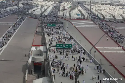 Muslim pilgrims walk to cast stones at a pillar, symbolizing the stoning of Satan, in a ritual called "Jamarat," a rite of the annual hajj, in Mina near the holy city of Mecca on October 05, 2014. The pilgrims perform a...