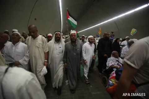 Muslim pilgrims arrive to cast stones at a pillar, symbolizing the stoning of Satan, in a ritual called "Jamarat," a rite of the annual hajj, in Mina near the holy city of Mecca on October 06, 2014. The pilgrims perform...
