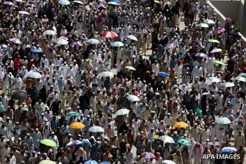 Muslim pilgrims walk to cast stones at a pillar, symbolizing the stoning of Satan, in a ritual called "Jamarat," a rite of the annual hajj, in Mina near the holy city of Mecca on October 06, 2014. The pilgrims perform a...