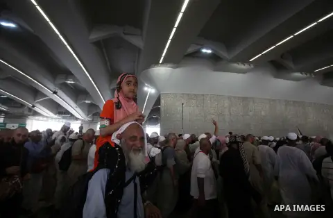 Muslim pilgrims arrive to cast stones at a pillar, symbolizing the stoning of Satan, in a ritual called "Jamarat," a rite of the annual hajj, in Mina near the holy city of Mecca on October 06, 2014. The pilgrims perform...