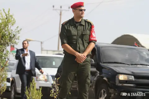 A Palestinian security officer stands guard upon the arrival of Prime Minister Rami Hamdallah to the Gaza Strip at Erez Crossing checkpoint, northern Gaza Strip on October 9, 2014. The Palestinian unity government which...