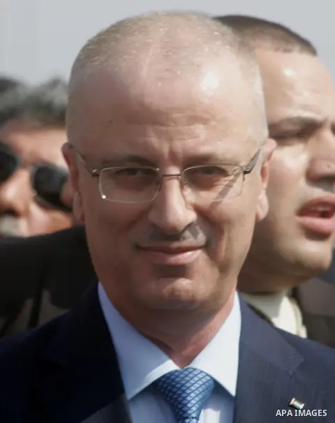 Palestinian Prime Minister Rami Hamdallah speaks to media upon his arrival to the Gaza Strip at Erez Crossing checkpoint, northern Gaza Strip on October 9, 2014. The Palestinian unity government which took the oath of of...