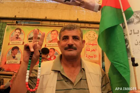 Palestinians take part in a protest demanding the release of their relatives prisoners held in Israeli jails, in front of the Red Cross office in Gaza City, on Oct. 13, 2014. Photo by Mohammed Asad