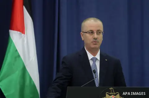 Palestinian prime minister Rami Hamdallah speaks during a joint press conference with UN Secretary-General Ban Ki-Moon (unseen) following the former's arrival in the West Bank city of Ramallah on October 13, 2014. Ban's...