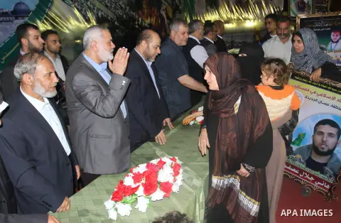Senior Hamas leader Ismail Haniyeh attends a ceremony organised by his movement to honor the relatives of who killed by Israel during the summer's fierce offensive, in Khan Younis in the southern Gaza Strip, October 23,...