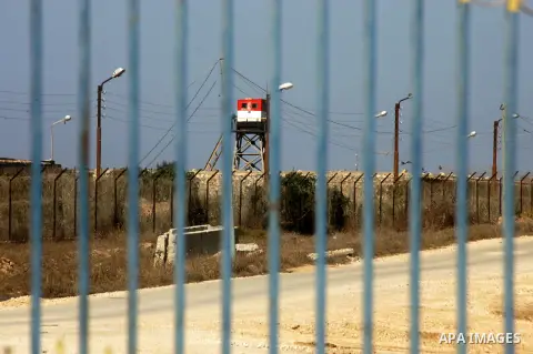 An Egyptian control tower is seen behind barbed wire at the Egyptian border with the Gaza Strip in the city of Rafah, southern Gaza Strip October 25, 2014. The decision was taken to close the Rafah crossing into the Gaza...