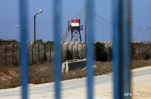 An Egyptian control tower is seen behind barbed wire at the Egyptian border with the Gaza Strip in the city of Rafah, southern Gaza Strip October 25, 2014. The decision was taken to close the Rafah crossing into the Gaza...