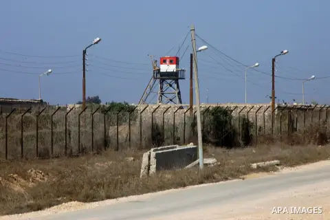 An Egyptian control tower is seen behind barbed wire at the Egyptian border with the Gaza Strip in the city of Rafah, southern Gaza Strip October 25, 2014. The decision was taken to close the Rafah crossing into the Gaza...