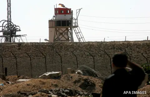 A Palestinian security officer looks on the gate under Egyptian control at the Rafah border crossing with Egypt in the southern Gaza Strip October 25, 2014. The decision was taken to close the Rafah crossing into the Gaz...