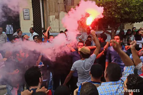 Egyptian students who support Muslim Brotherhood and ousted president Mohammed Morsi, shot slogans during a demonstration against military rule, at Cairo University, in Cairo, October 27, 2014. Anti-Coup students have la...