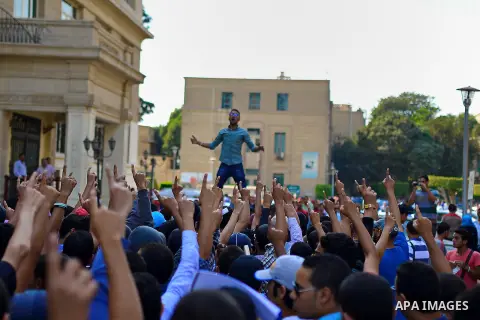 Egyptian students who support Muslim Brotherhood and ousted president Mohammed Morsi, shot slogans during a demonstration against military rule, at Cairo University, in Cairo, October 27, 2014. Anti-Coup students have la...