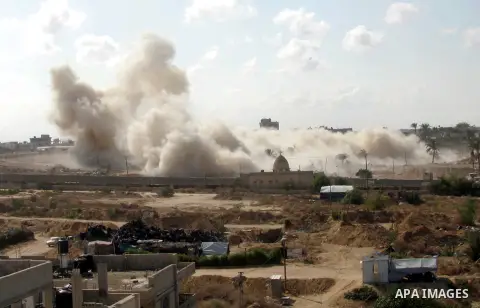 Smoke rises after a house was blown up during a military operation by Egyptian security forces in the Egyptian city of Rafah near the border with southern Gaza Strip October 29, 2014, as Egypt began setting up a buffer z...